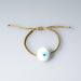 White Ceramic Evil Eye Bracelet from OIYA - SHOPELEOS